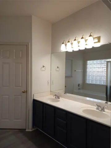 a bathroom with a bathtub and shower