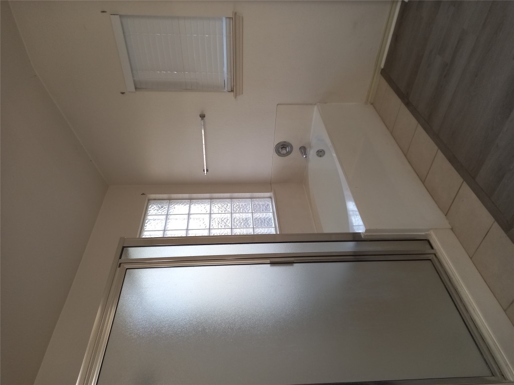 2018 Old Mill Road Cedar Park, TX 78613 - Photo 10 of 22 a bathroom with a bathtub and shower