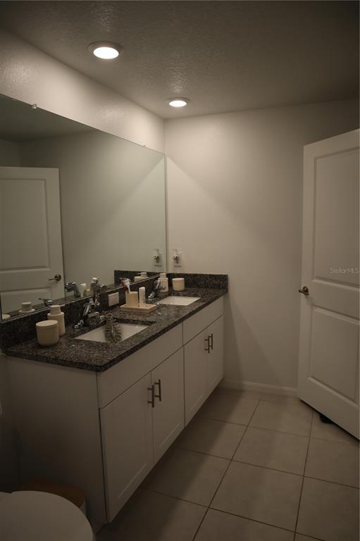 8339 Birch Hvn Lane New Port Richey, FL 34655 - Photo 10 of 16 a bathroom with a sink and a mirror