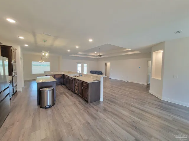 a kitchen with a sink and a microwave