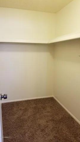 a view of a hallway with a room