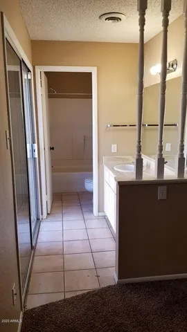 a view of a livingroom with a chandelier fan