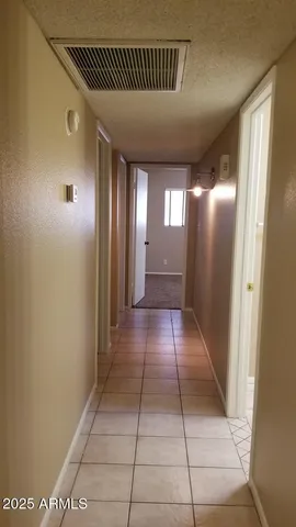 a view of a hallway with a room