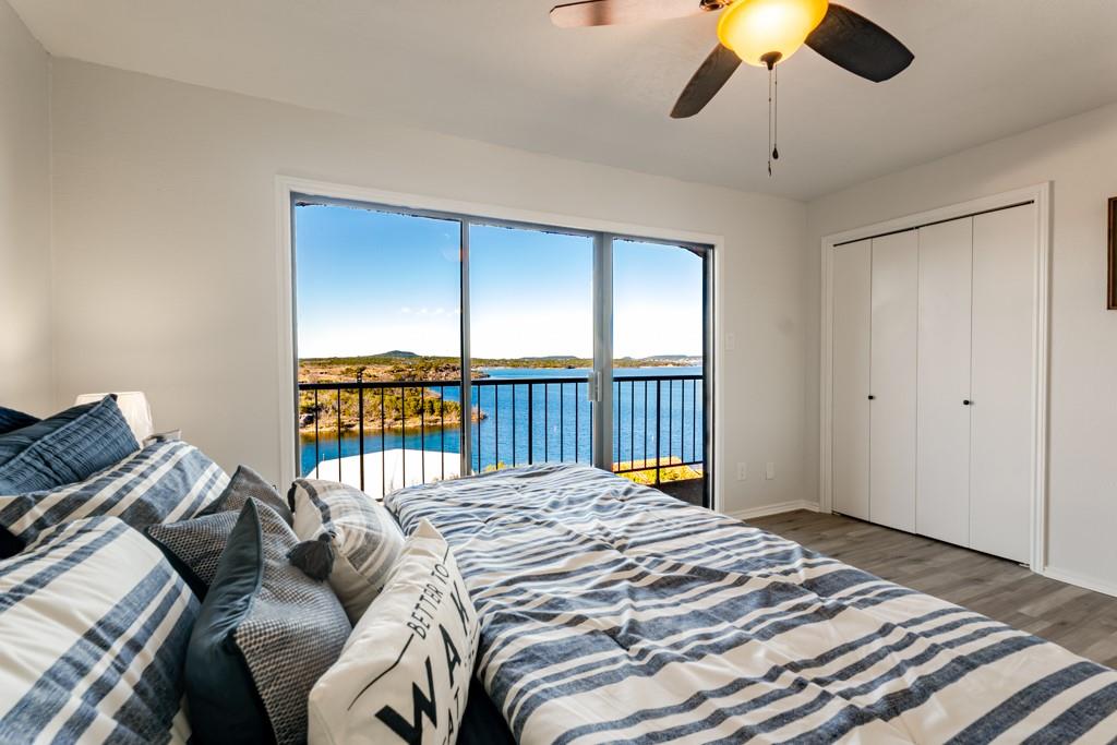 3107 Hells Gate Loop, Unit B62 Strawn, TX 76475 - Photo 1 of 24 a bed sitting in a bedroom next to a window
