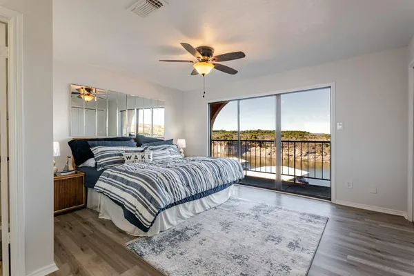 a bedroom with a large bed and a window