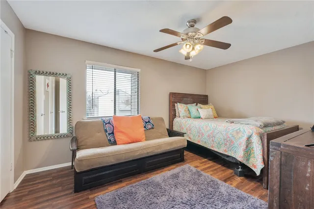 a bedroom with a large bed and a couch