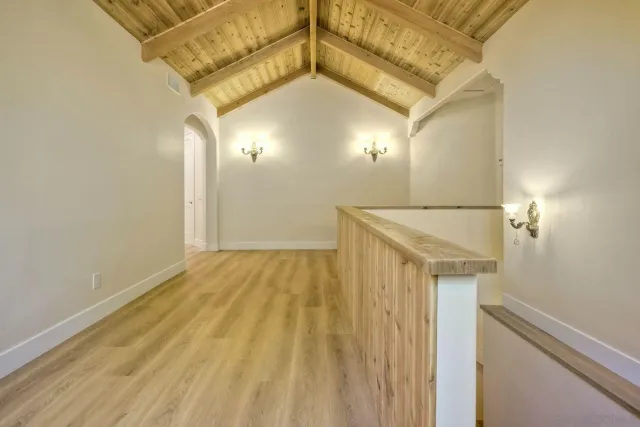a bathroom with a granite countertop toilet and a sink