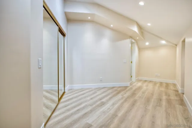 a view of a refrigerator in kitchen and wooden floor