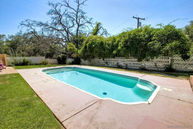 an aerial view of a golf course with parking space