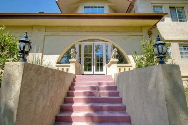 a front view of house with yard and green space