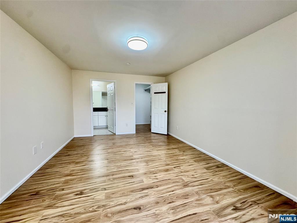 22 Regency Circle Englewood, NJ 07631 - Photo 13 of 21 a view of empty room with wooden floor