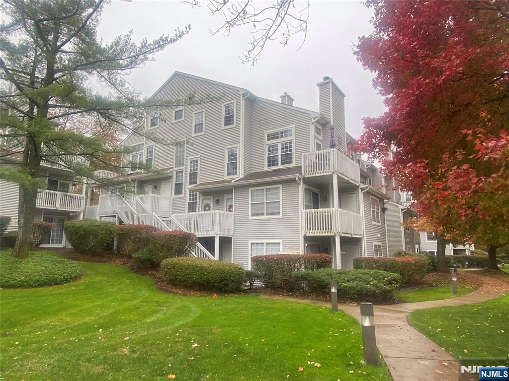 22 Regency Circle Englewood, NJ 07631 - Photo 2 of 21 a view of a building with a yard