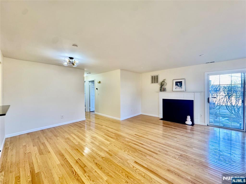 22 Regency Circle Englewood, NJ 07631 - Photo 7 of 21 a view of empty room with wooden floor