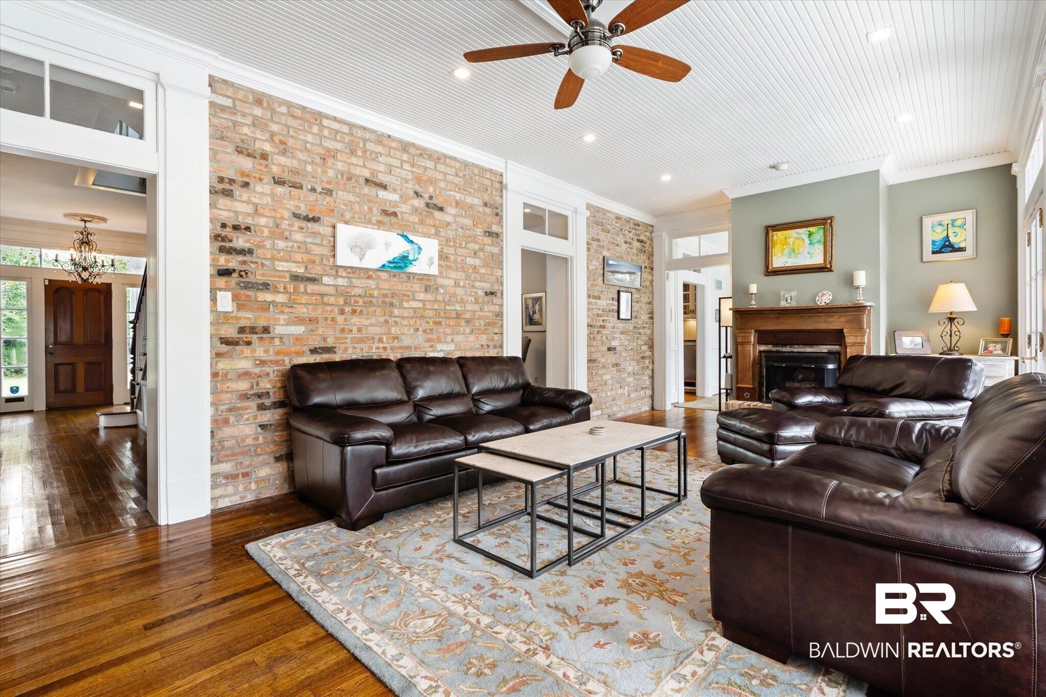2205 Spring Hill Avenue Mobile, AL 36607 - Photo 20 of 59 Living room with brick wall, ornamental molding, ceiling fan, and hardwood / wood-style floors