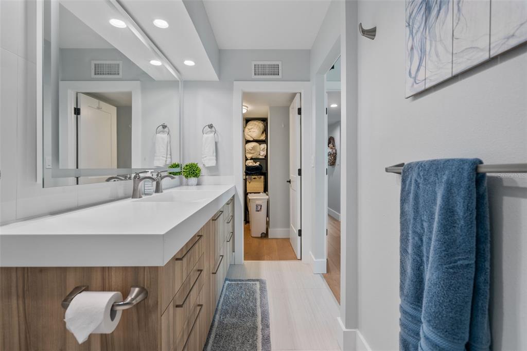 1050 Longboat Club Road, Unit 901 Longboat Key, FL 34228 - Photo 21 of 37 a bathroom with a sink and a mirror