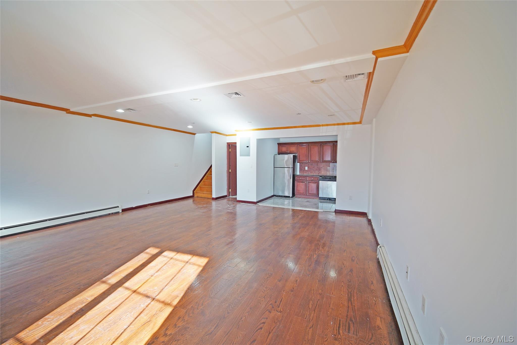 931 East 215th Street, Unit 2 Bronx, NY 10469 - Photo 4 of 16 a view of empty room with wooden floor