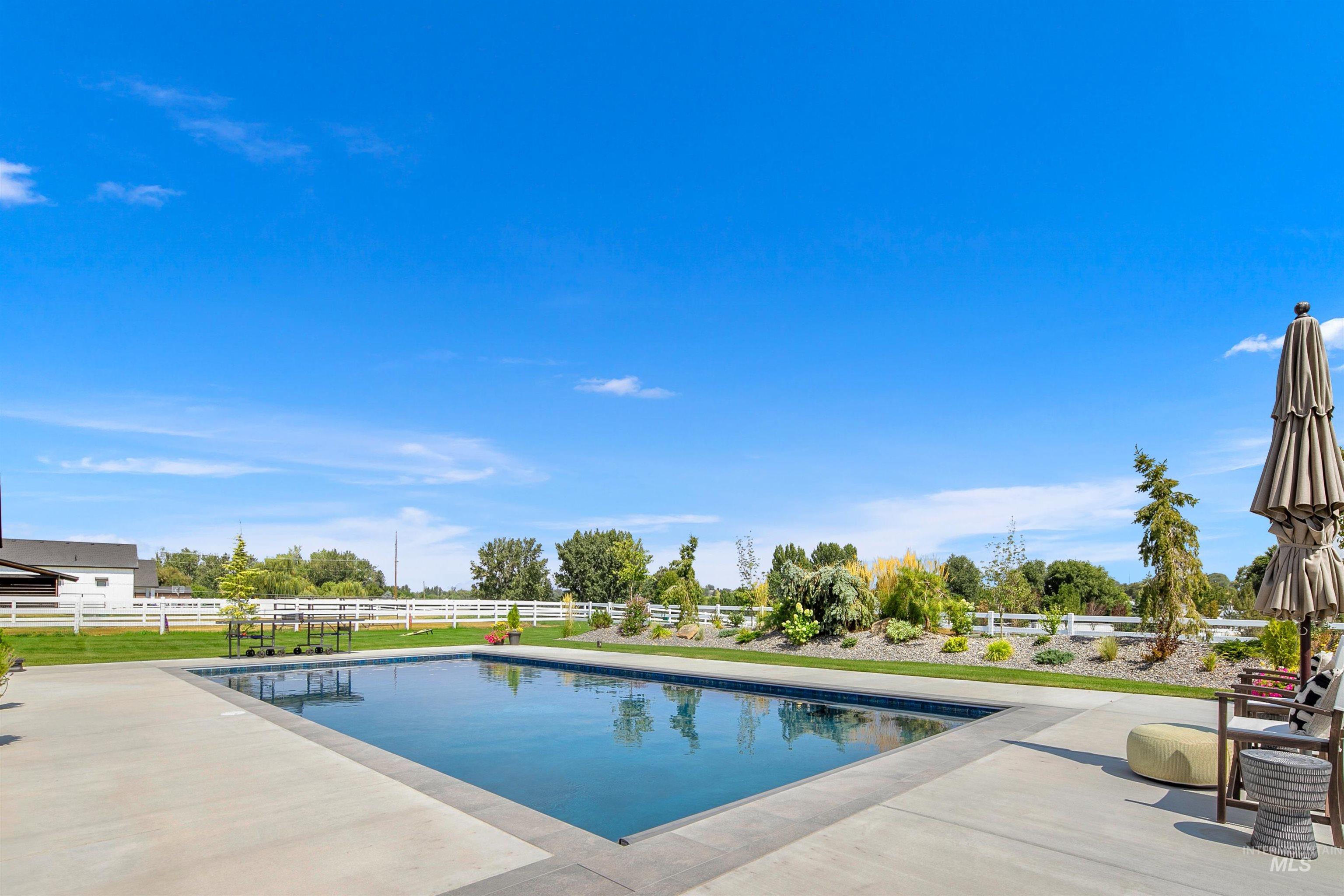 23910 Timber Hls Road Caldwell, ID 83607 - Photo 3 of 50 View of pool with a patio