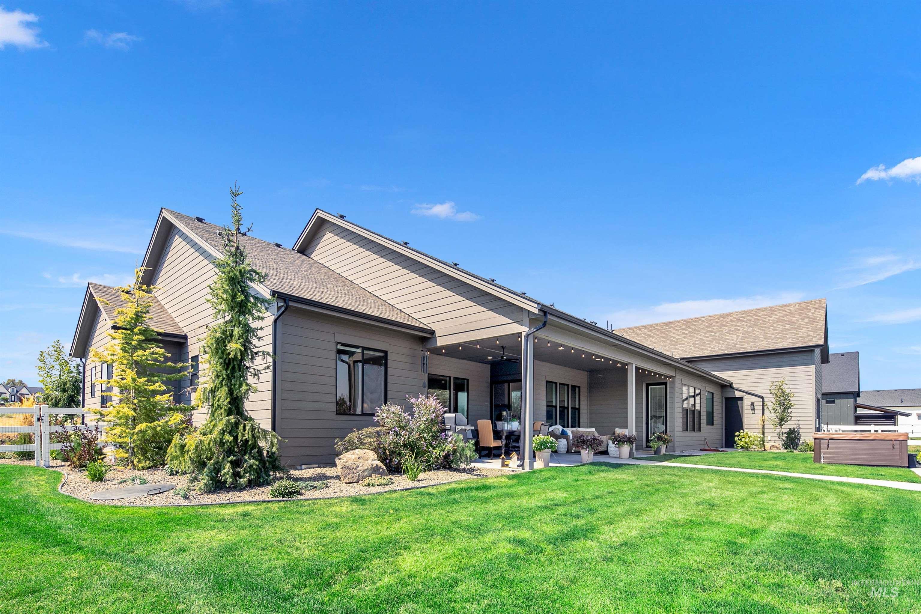 23910 Timber Hls Road Caldwell, ID 83607 - Photo 40 of 50 Rear view of property with a patio, outdoor lounge area, and a shingled roof