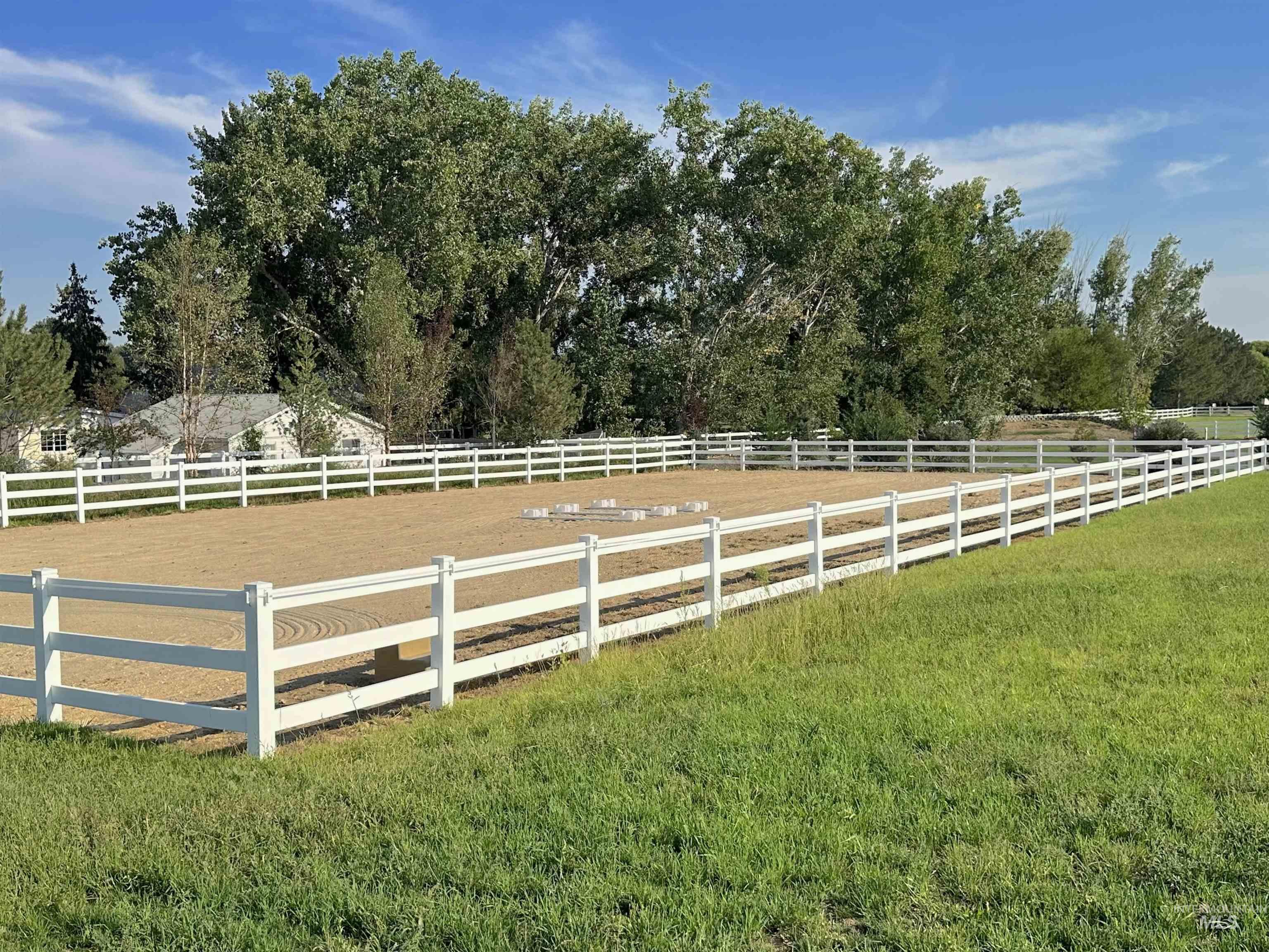 23910 Timber Hls Road Caldwell, ID 83607 - Photo 4 of 50 View of grassy yard with an enclosed horse arena and a rural view