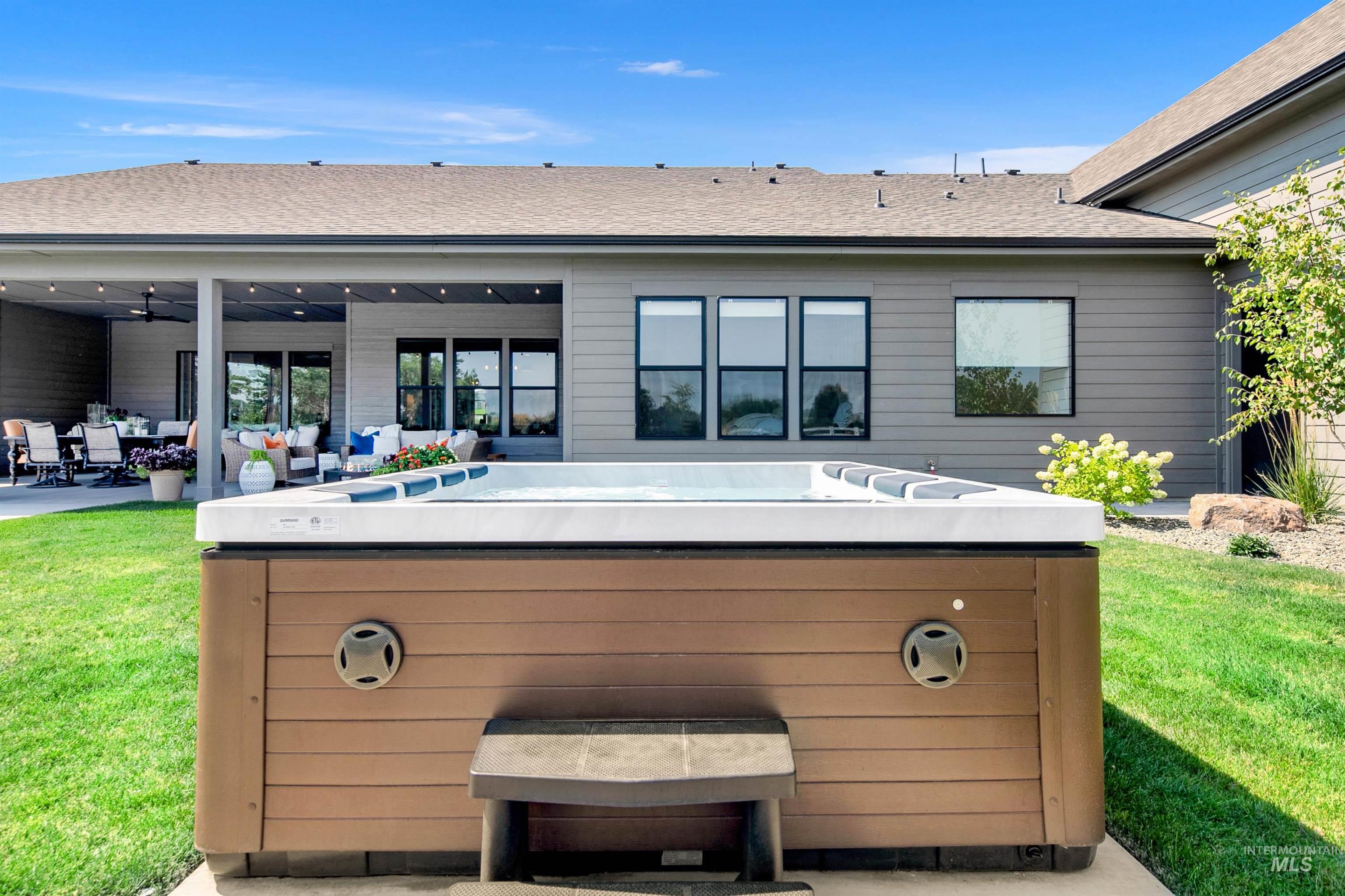 23910 Timber Hls Road Caldwell, ID 83607 - Photo 44 of 50 View of patio / terrace featuring a hot tub, outdoor lounge area, and a ceiling fan