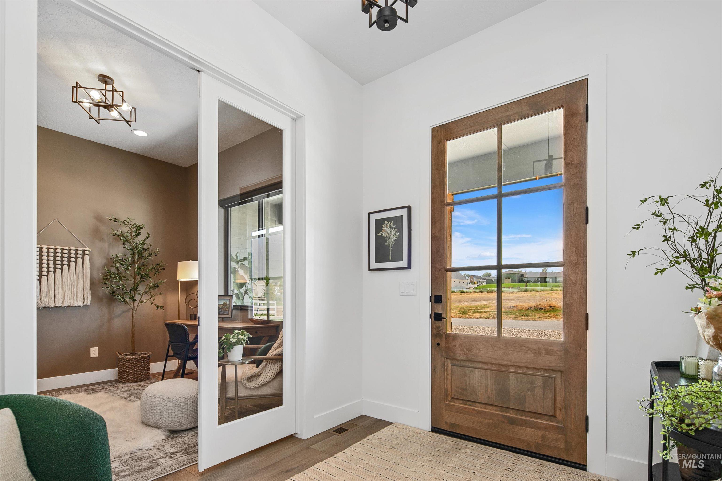 23910 Timber Hls Road Caldwell, ID 83607 - Photo 7 of 50 Entryway featuring wood finished floors and recessed lighting