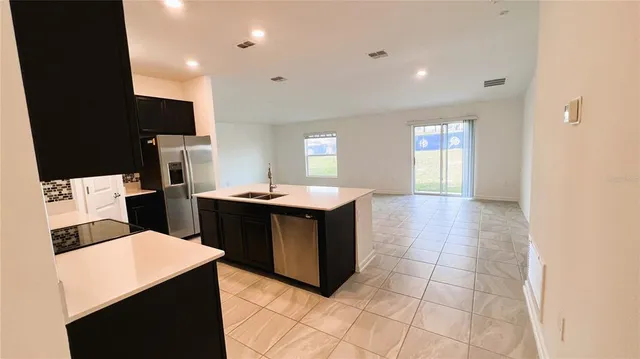 a bathroom with a sink vanity and a mirror