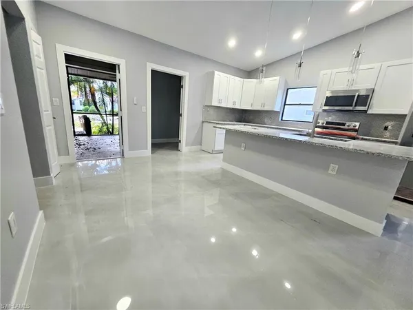 a view of kitchen with wooden floor