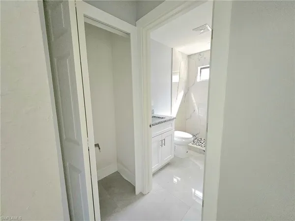 a bathroom with a toilet sink