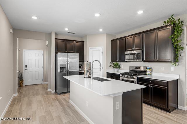 547 Tynes Boulevard Middleburg, FL 32068 - Photo 14 of 33 a kitchen with stainless steel appliances a sink stove and refrigerator