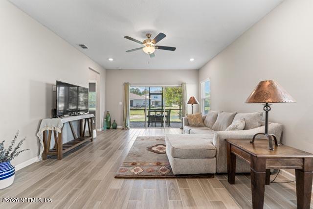 547 Tynes Boulevard Middleburg, FL 32068 - Photo 18 of 33 a living room with furniture and a flat screen tv