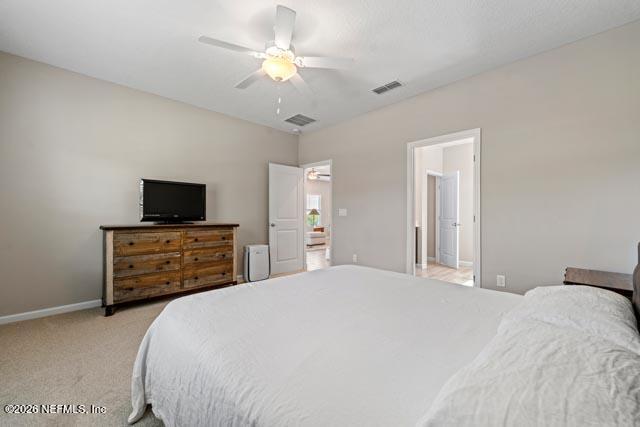 547 Tynes Boulevard Middleburg, FL 32068 - Photo 20 of 33 a bedroom with a bed and a flat screen tv