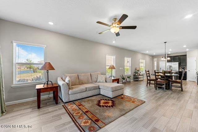547 Tynes Boulevard Middleburg, FL 32068 - Photo 24 of 33 a living room with furniture and wooden floor