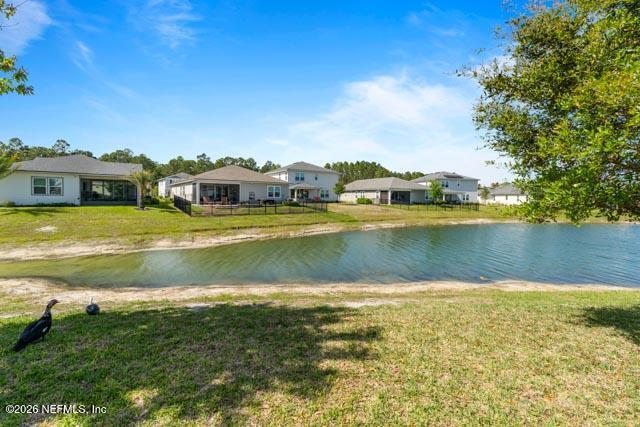 547 Tynes Boulevard Middleburg, FL 32068 - Photo 27 of 33 a view of a lake with houses in the background