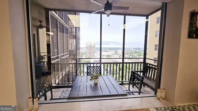 a view of a balcony with furniture