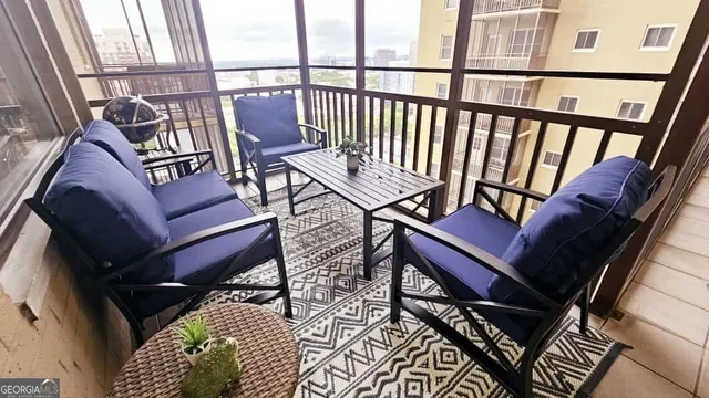 a view of a balcony with furniture