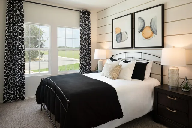 a bedroom with a bed and window