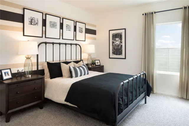 a bedroom with a bed and window