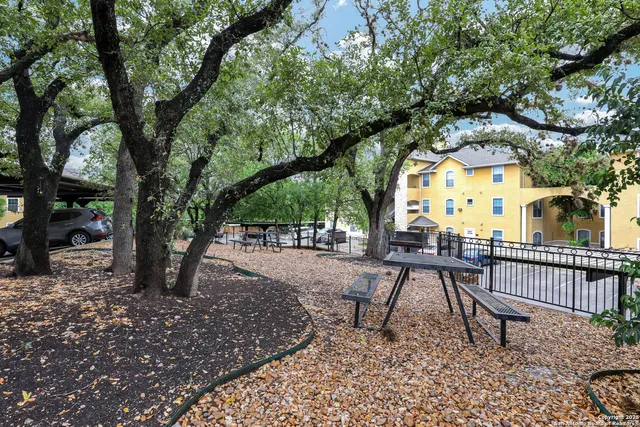 a view of a sitting area in a backyard