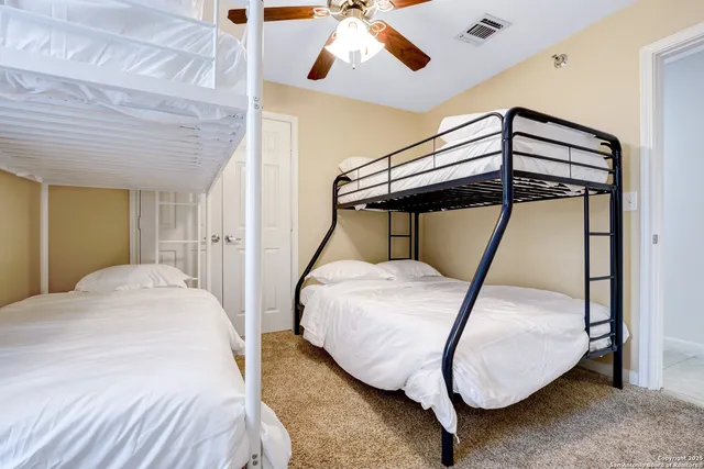 a bedroom with a bed and a mirror