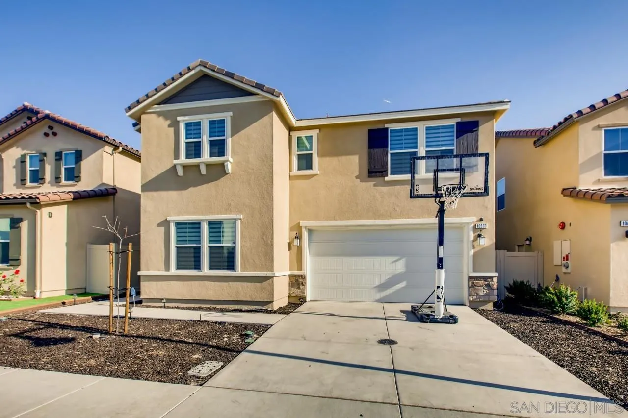 a front view of a house with garage
