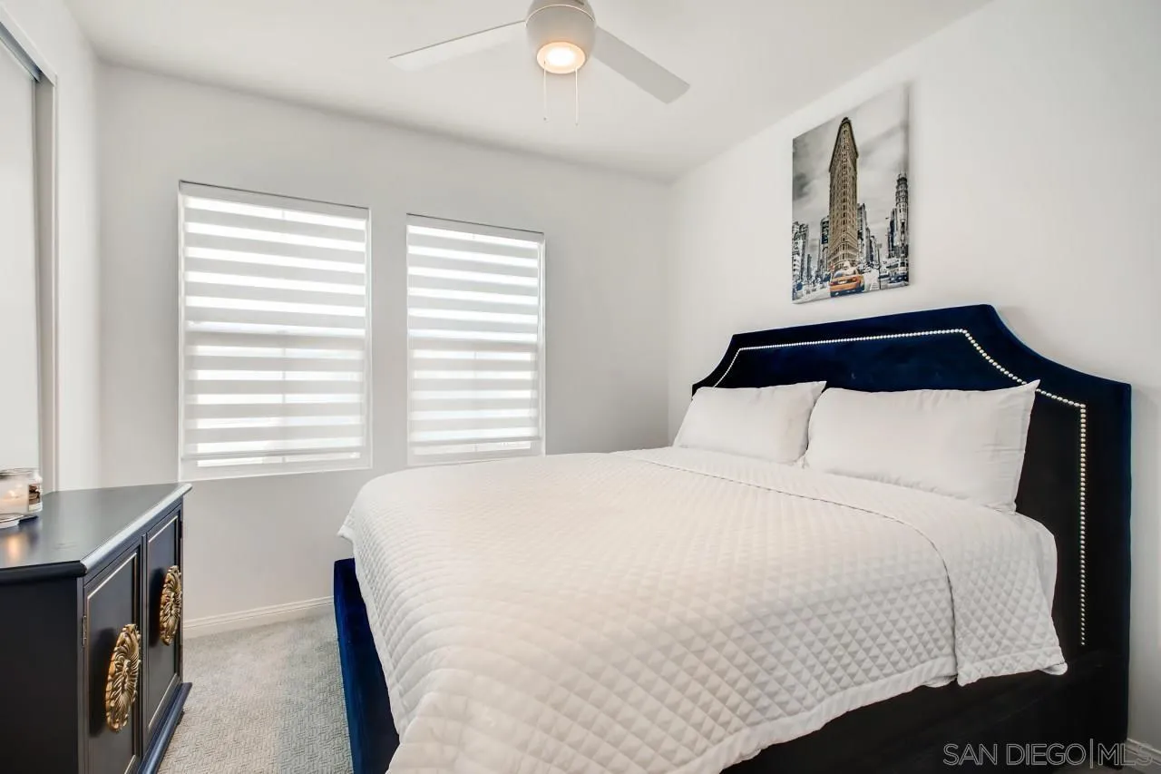 10633 Busch Street Spring Valley, CA 91978 - Photo 14 of 28 a bedroom with a bed and a window