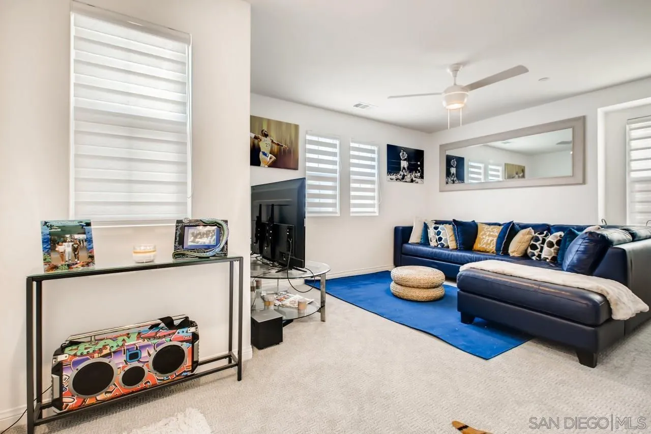 10633 Busch Street Spring Valley, CA 91978 - Photo 22 of 28 a living room with furniture and a table