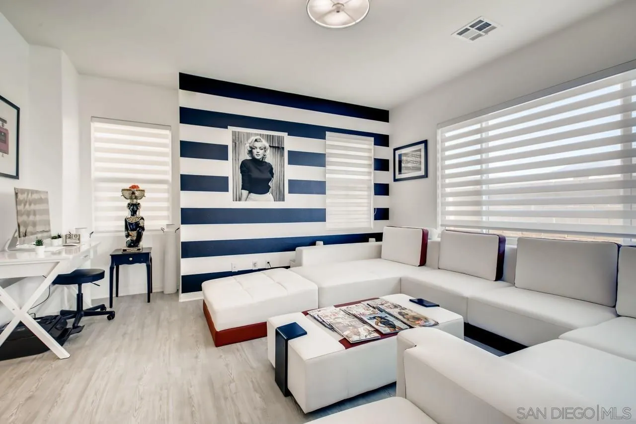 10633 Busch Street Spring Valley, CA 91978 - Photo 5 of 28 a living room with furniture and wooden floor