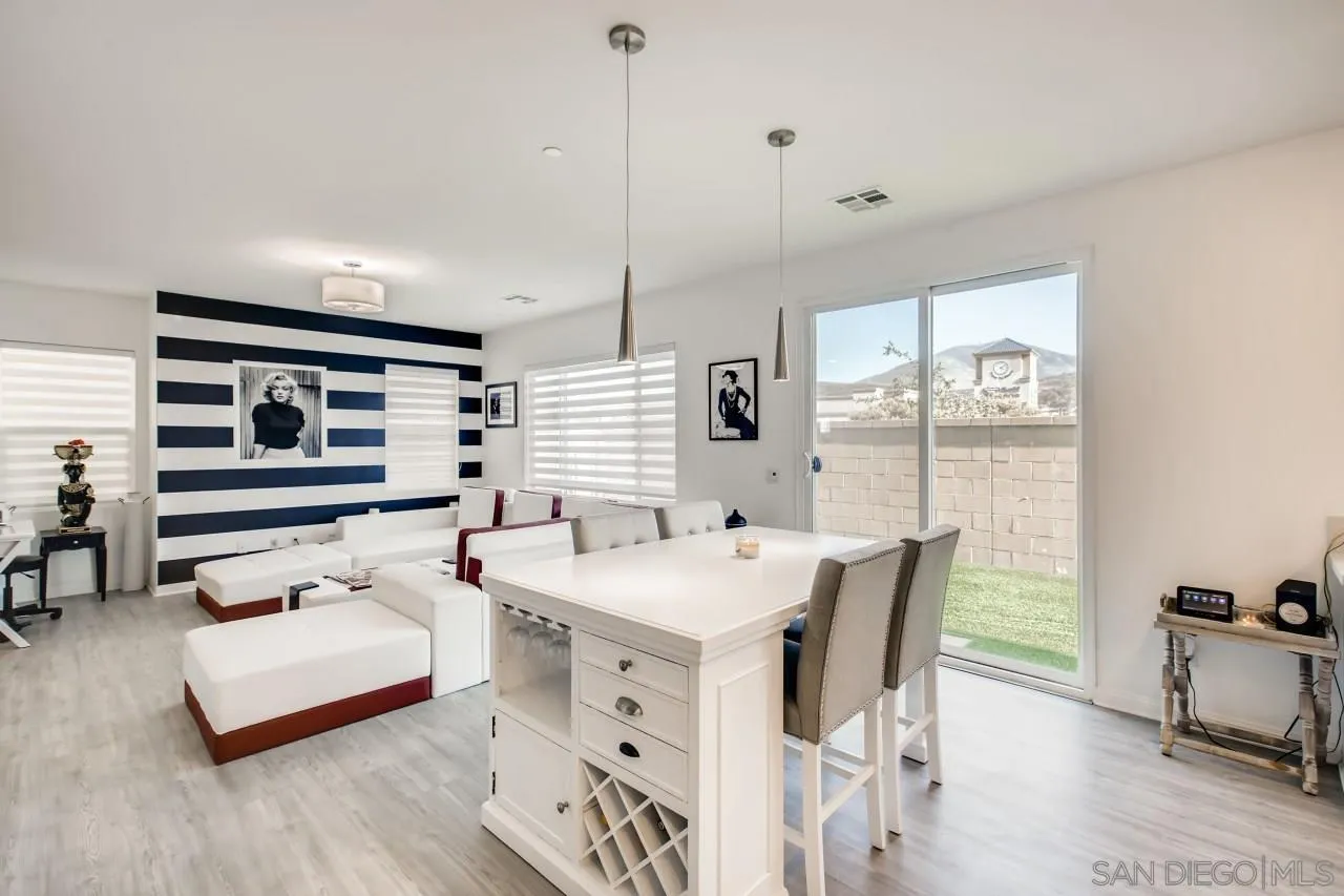 10633 Busch Street Spring Valley, CA 91978 - Photo 6 of 28 a bedroom with furniture and a large window