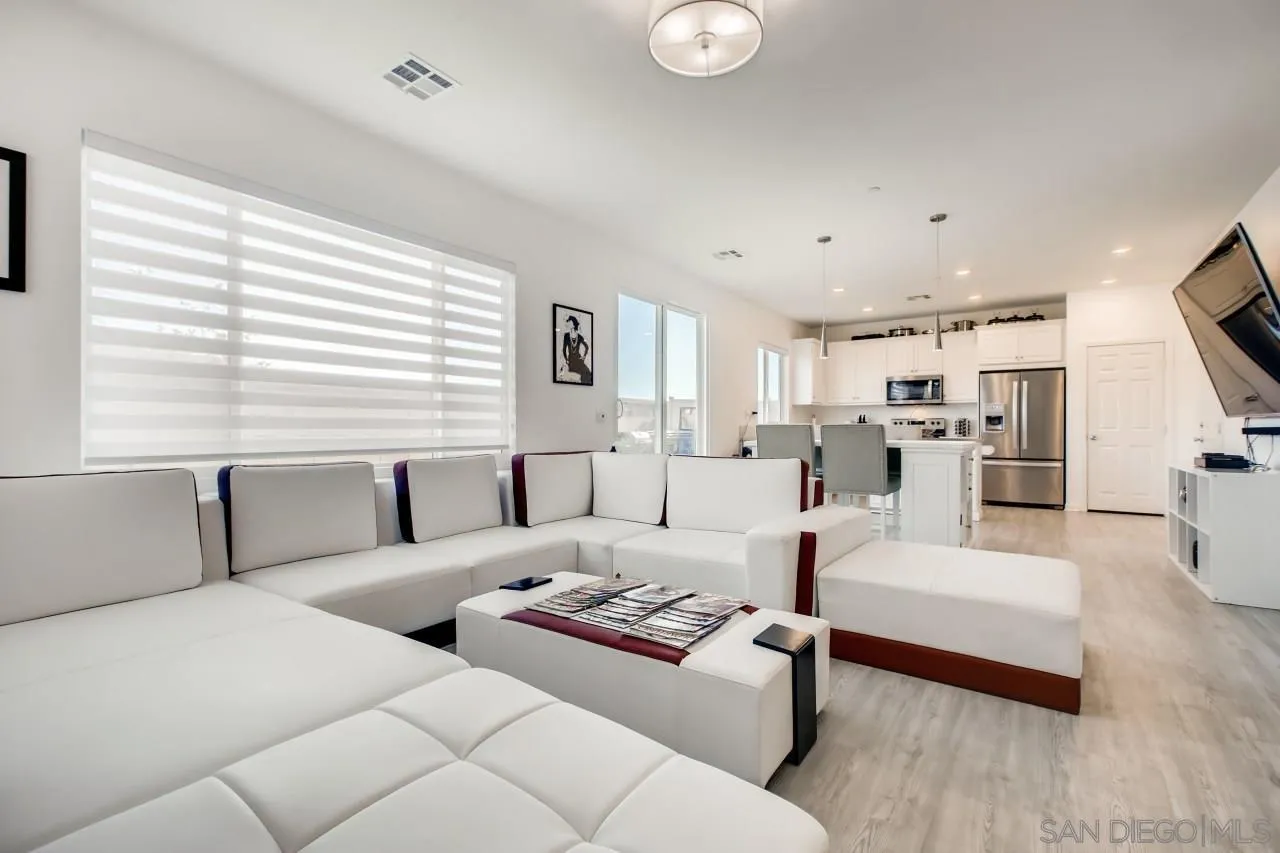 10633 Busch Street Spring Valley, CA 91978 - Photo 8 of 28 a living room with furniture and a large window