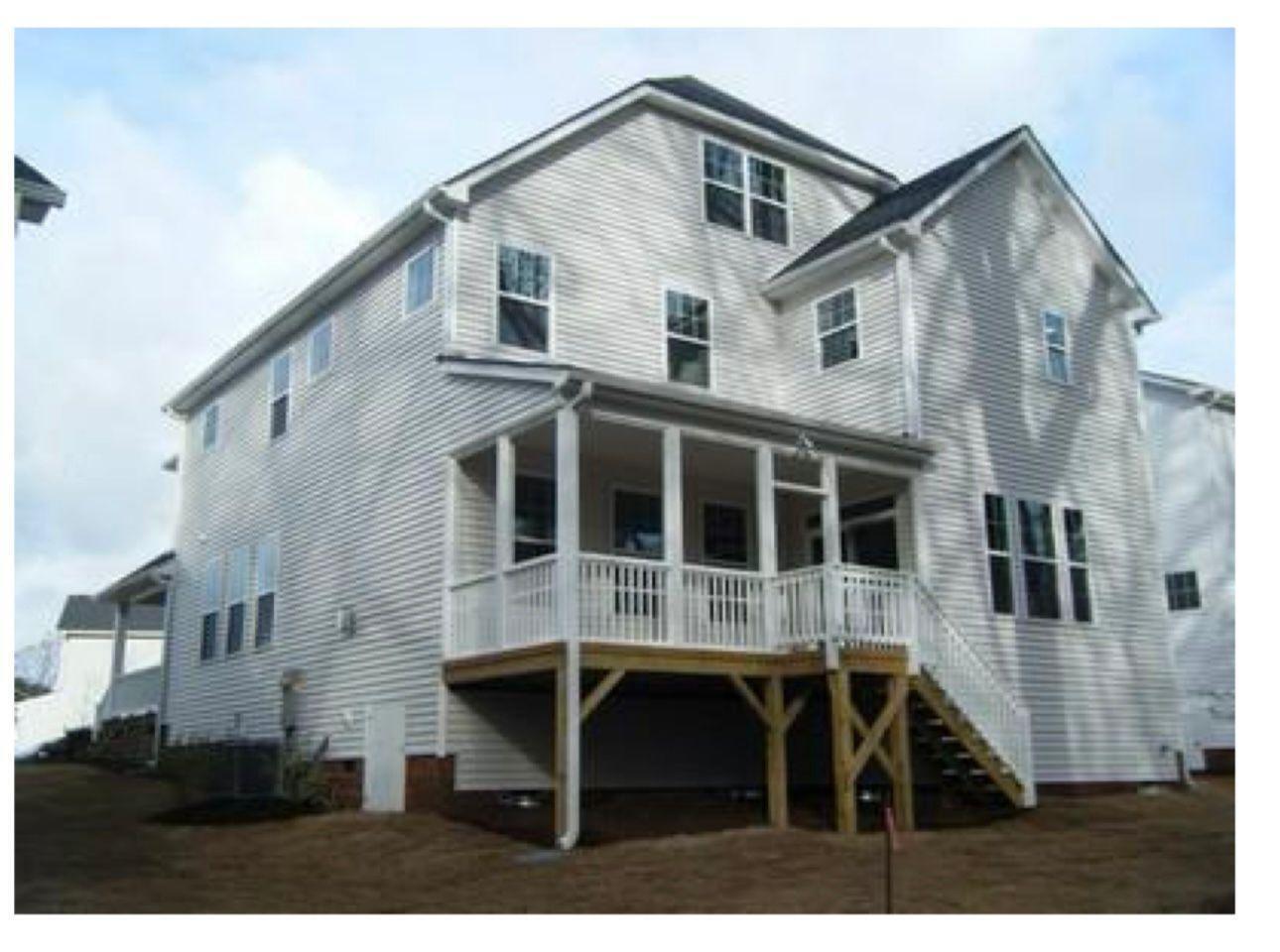 154 Attavar Way Garner, NC 27529 - Photo 11 of 22 a front view of a house with a yard and garage