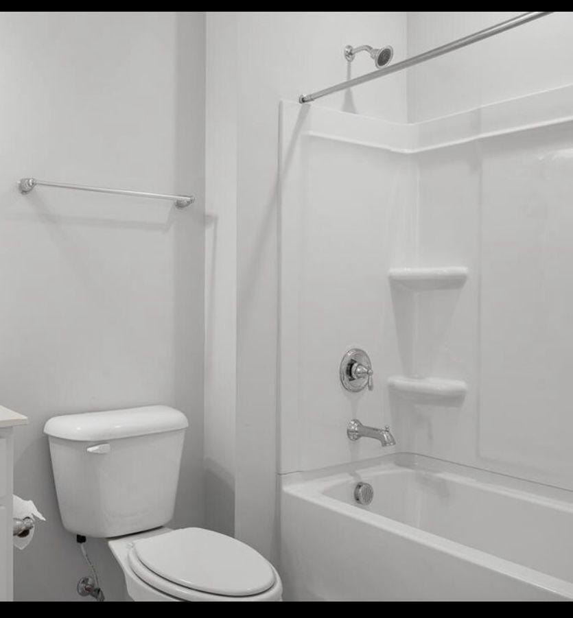 154 Attavar Way Garner, NC 27529 - Photo 12 of 22 a white toilet sitting next to a bath tub