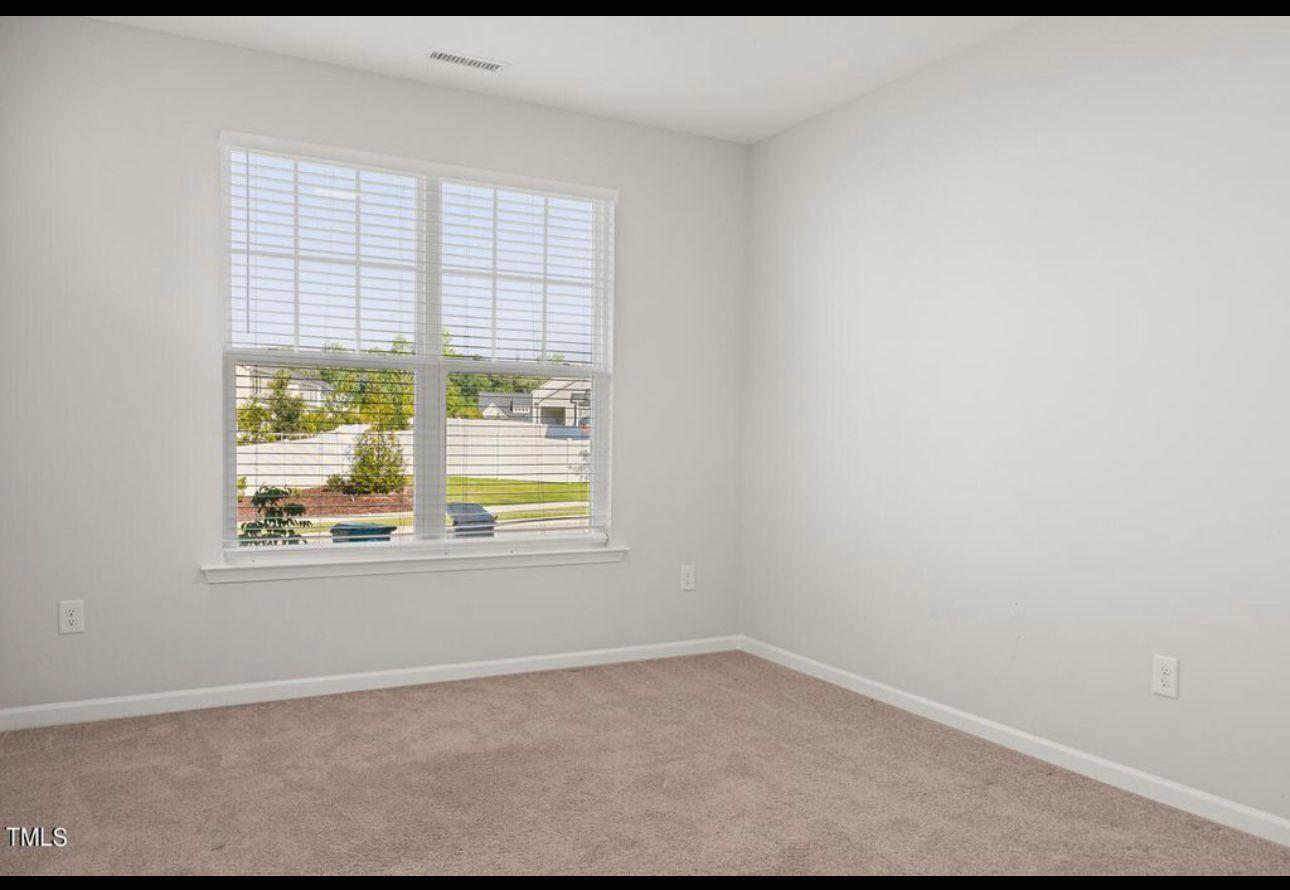 154 Attavar Way Garner, NC 27529 - Photo 20 of 22 an empty room with a window
