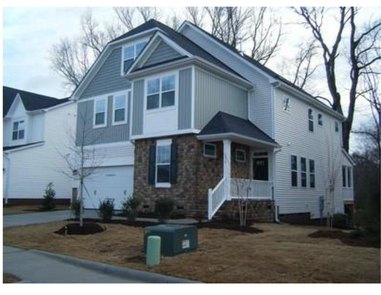 154 Attavar Way Garner, NC 27529 - Photo 2 of 22 a front view of a house with a yard