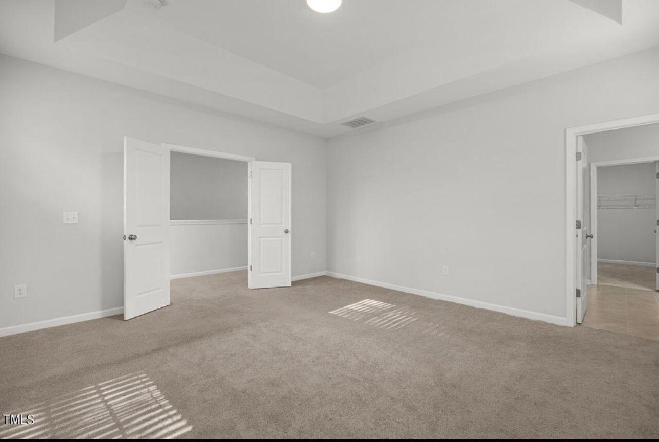 154 Attavar Way Garner, NC 27529 - Photo 22 of 22 a view of an empty room and window